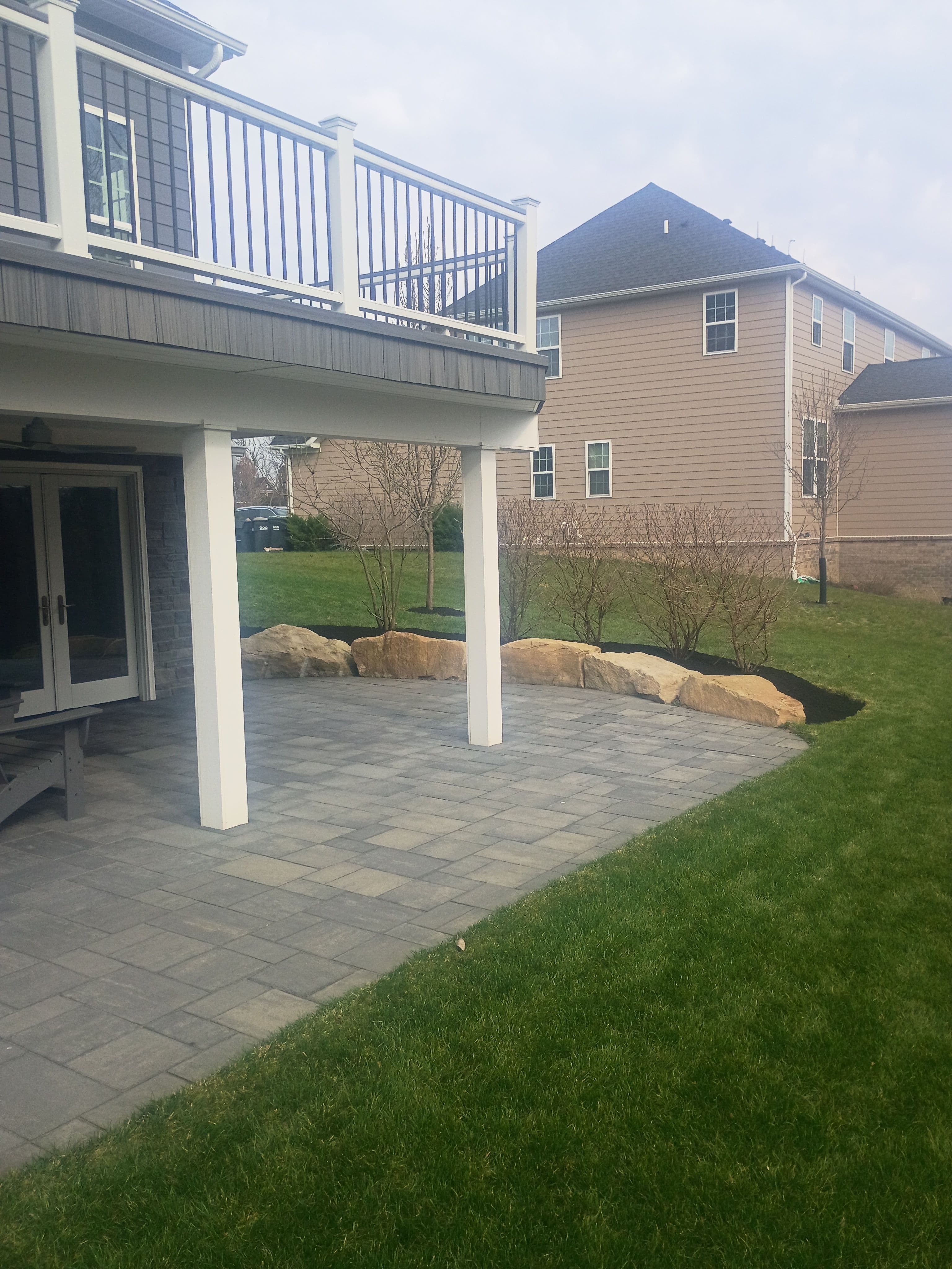 Project Black Mulch, Boulder Accents and a Paver Patio Done Right image
