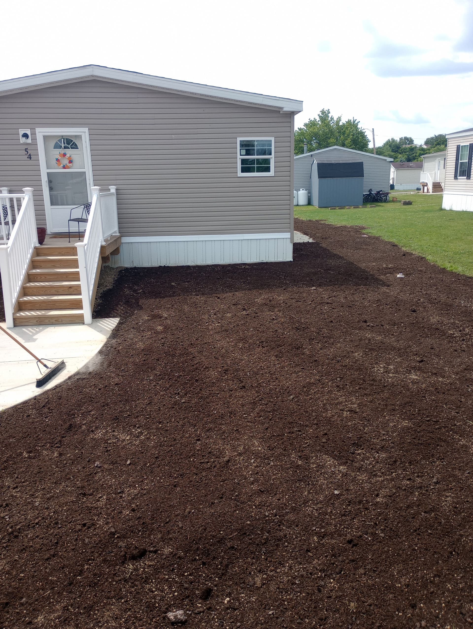 Gallery photos for Yard Overhaul with Topsoil and Grass at Local Mobile Homes: Image #1